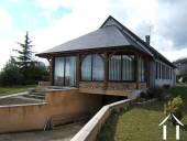This shows the large verandah (47m2) attached to the house. The entrance to the sous-sol under the house can also be seen