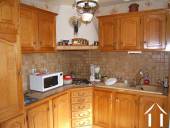 This shows part of the fitted kitchen with the oak cabinets