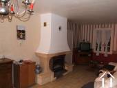 Thi is part of the dining cum living room with its fireplace and insert
