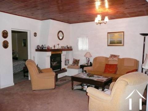 The lounge area has French windows giving good light. Off this room are the two original bedrooms, one of which is currently used as a dining room.