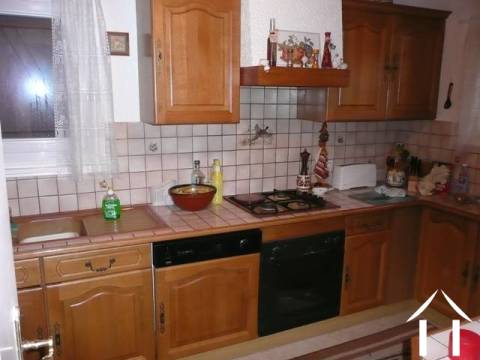 The kitchen has been upgraded to modern style country cabinets with a tiled work surface. All the fittings remain such as the integrated dishwasher, electric oven and hob.