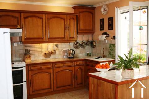 The kitchen is fitted with modern country-style units. The main entrance to the house is via the conservatory into the kitchen. 