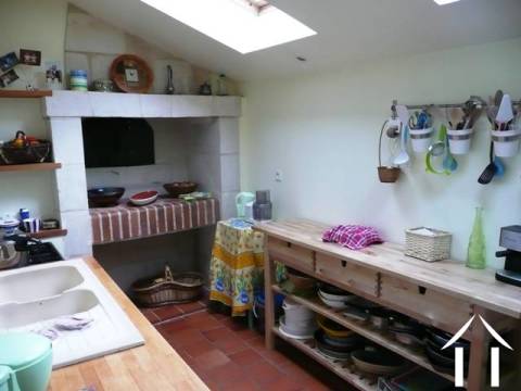 The kitchen with working bread oven - although small by comparison with other rooms it is perfectly functional and benefits from having a walk-in larder area. 