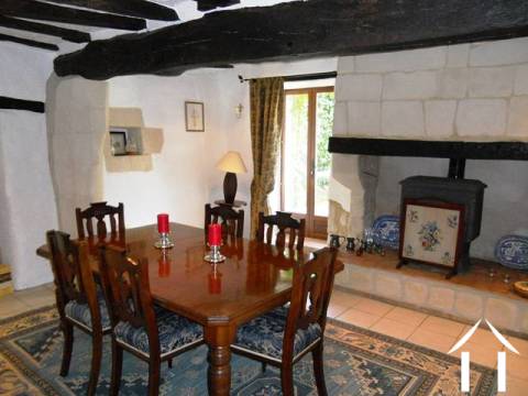 A very impressive dining room (20m2+) with feature fireplace and oak beams and revealed stone walls. 