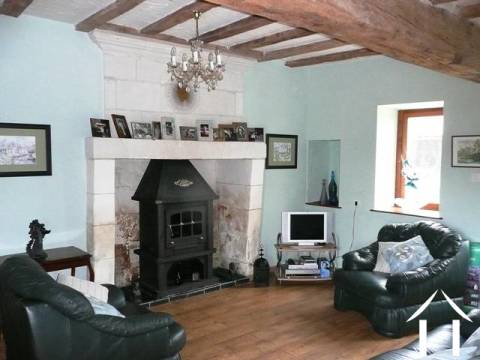 This is the lounge in the barn conversion. The wood burning stove in the feature fireplace is included in the sale. 
