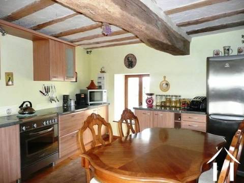 he modern, fitted kitchen in the barn conversion has windows overlooking both the courtyard and the garden / open countryside and orchards. 