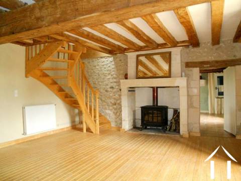 An impressive room. The lounge has a feature fireplace (the wood burning stove is included in the sale price), exposed stone walls and oak beams throughout. 