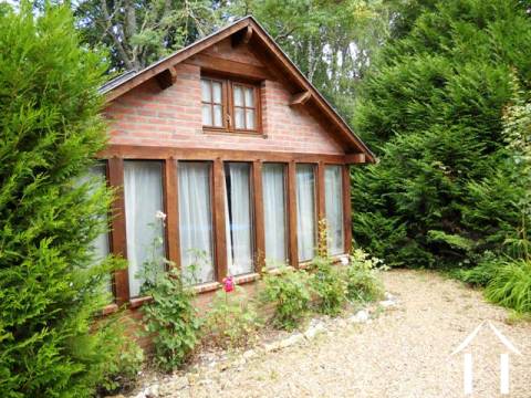 The independent gîte comprises a small lounge and dining area with a corner kitchen (cuisine américaine), a double bedroom and a compact 2nd bedroom (suitable for bunk beds). There is a shower room with WC. The total living area is 60m2. 
