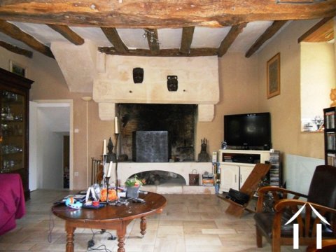 The large, feature fireplace. Beyond (the doorway to the left) is the bureau/library.