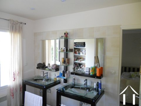 To give some idea of the modern styling; this is the bathroom area of the downstairs bedroom. Not shown is the large walk-in shower and the separate dressing room.