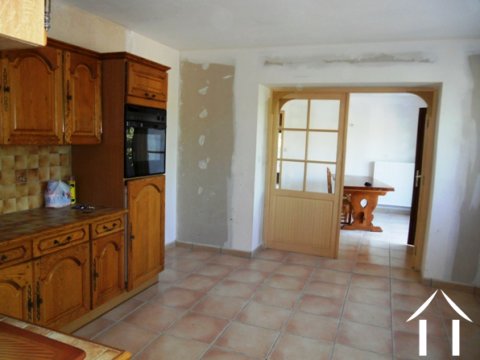 The kitchen is literally at the centre of the home. It has large internal doors opening into the dining room.