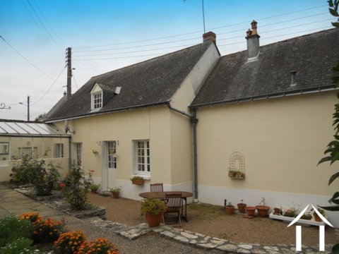 The maison d'amis forms one side of the property boundary facing into a 450m2 courtyard-style garden.