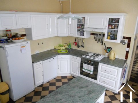 The modern fitted kitchen located off the entrance lobby in the house.
