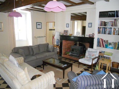 The large lounge on the Ground Floor of the house. This room has lots of light with windows to the front and French doors opening onto the courtyard style garden to the rear.