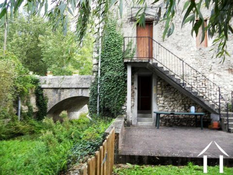 Here we can see the side of the river side of the property. The exterior staircase rises from the garden to the Ground Floor (into the kitchen).