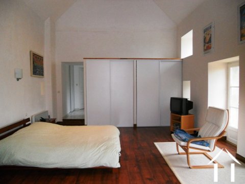 The largest and most impressive room in the property is the master bedroom. It oozes light and space and has double doors overlooking the garden and rolling hills.  The room has a wood floor, built-in wardrobes and a large ensuite bathroom.  It also benefits from having a mezzanine area, approached via an hardwood staircase, which provides an excellent study/bureau.