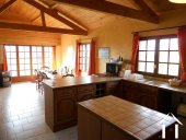 The kitchen / dining area is full of light, character features (exposed tuffeau stone wall and high grade woodwork) and great views of the open countryside that surrounds the hamlet.