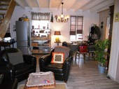 The lounge area, which is slightly offset within the living room. Here, the French windows overlook the large back garden.