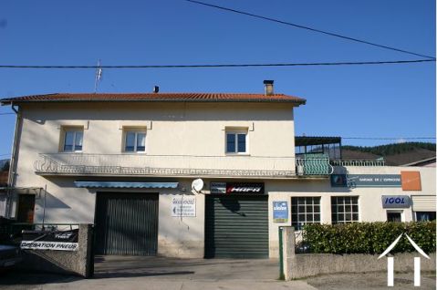 House with courtyard and 2 garages.