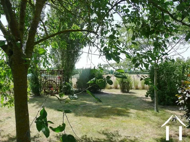 Half an acre of manicured gardens, with outlook onto open countryside and the village in the distance. 