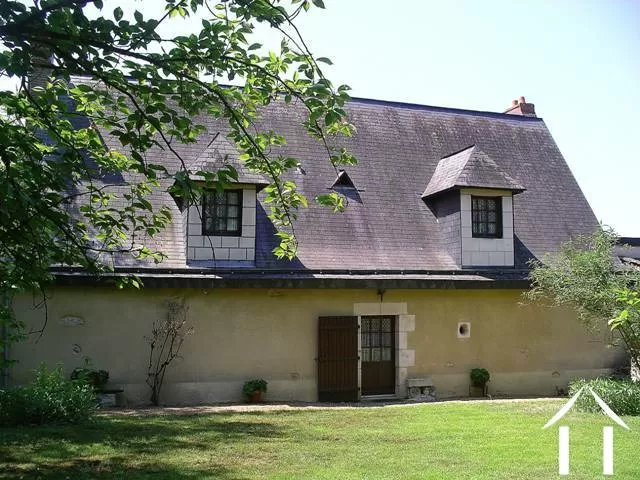 The house is of classic styling with a high pitch ardoise slate roof and tuffeau limestone (the local stone) construction.
