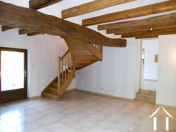 This is the sejour. From here the staircase rises to the master bedroom. The stepts and doorway give access to the rest of the house.