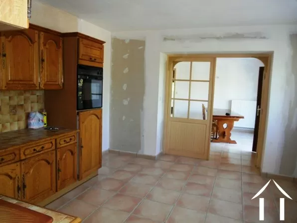 The kitchen is literally at the centre of the home. It has large internal doors opening into the dining room.