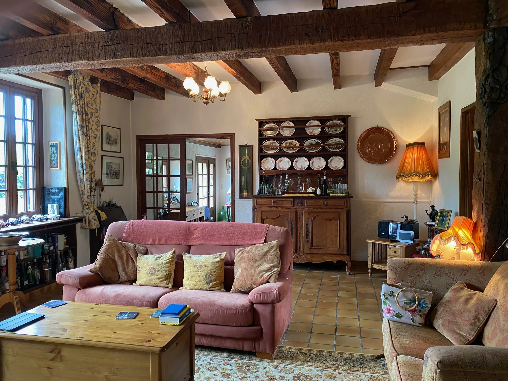 Another view of the living room. At the back, the dining room.