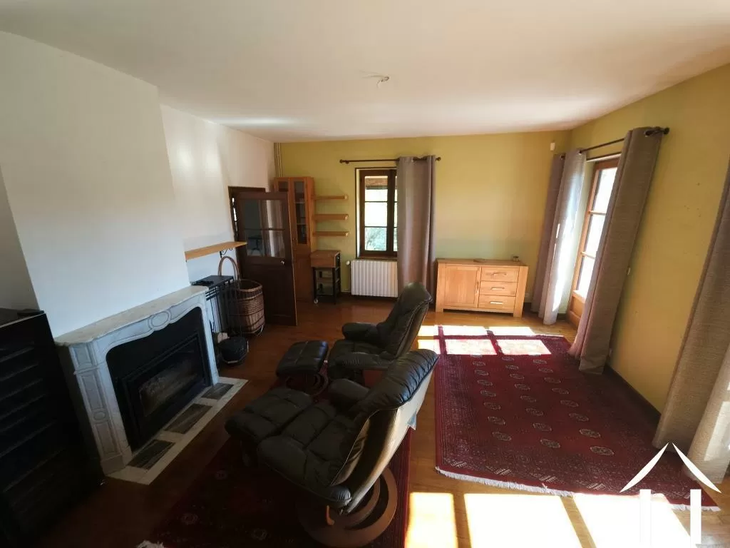 Living room with fireplace and access to the balcony terrace