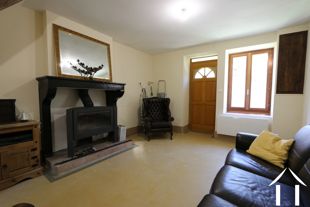 Sitting room with fireplace and wood burner