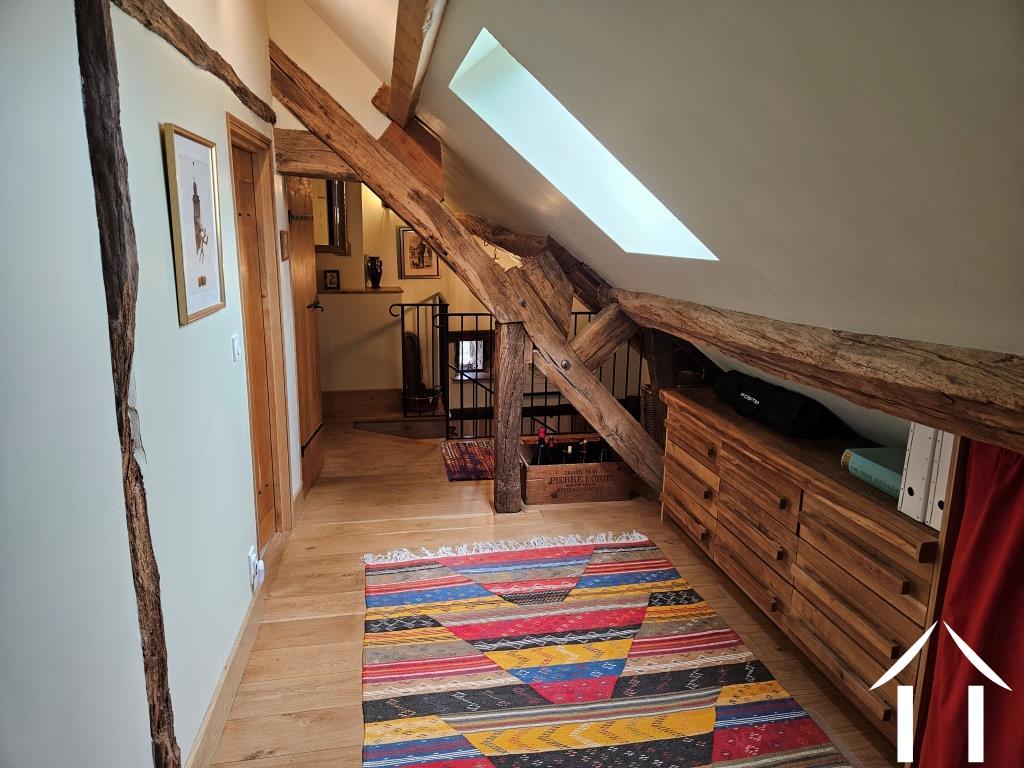 Upper floor hall connecting the two bedrooms and bathroom
