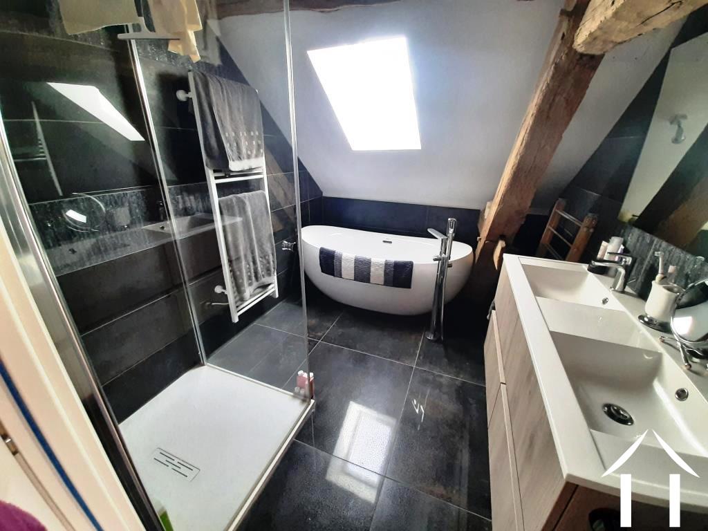 Bathroom with bath, shower and double wash basins