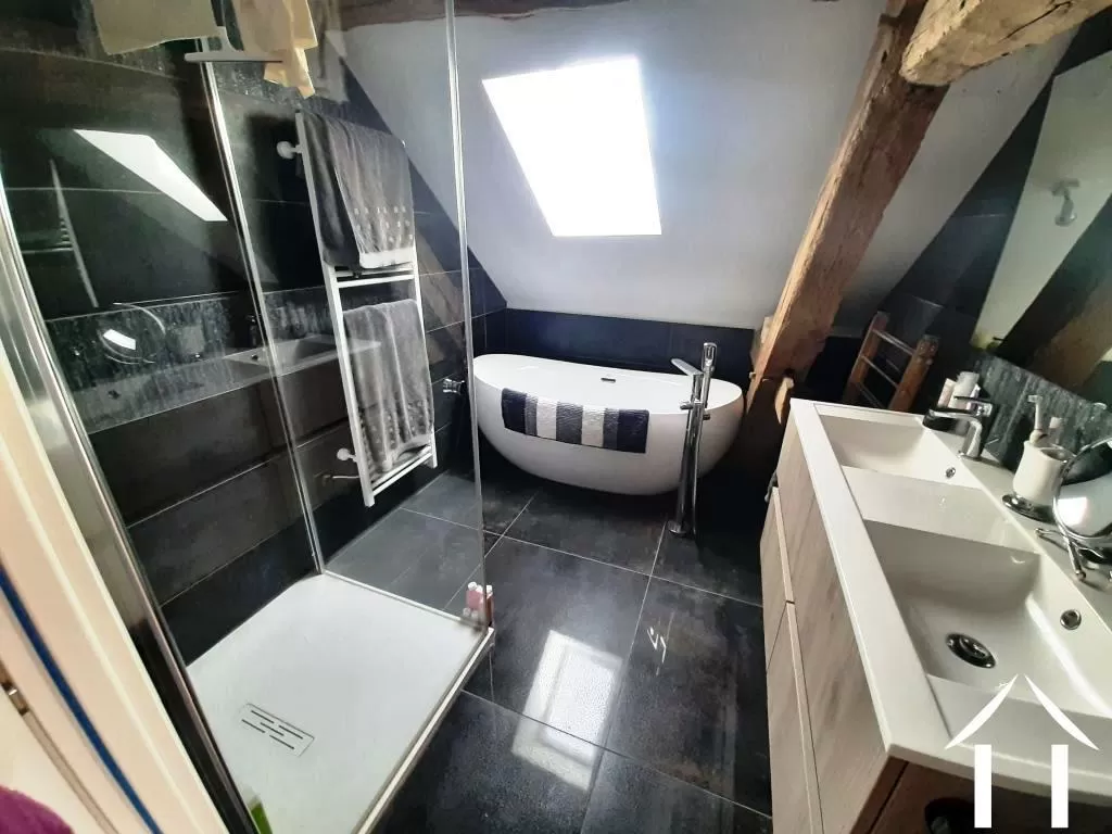 Bathroom with bath, shower and double wash basins