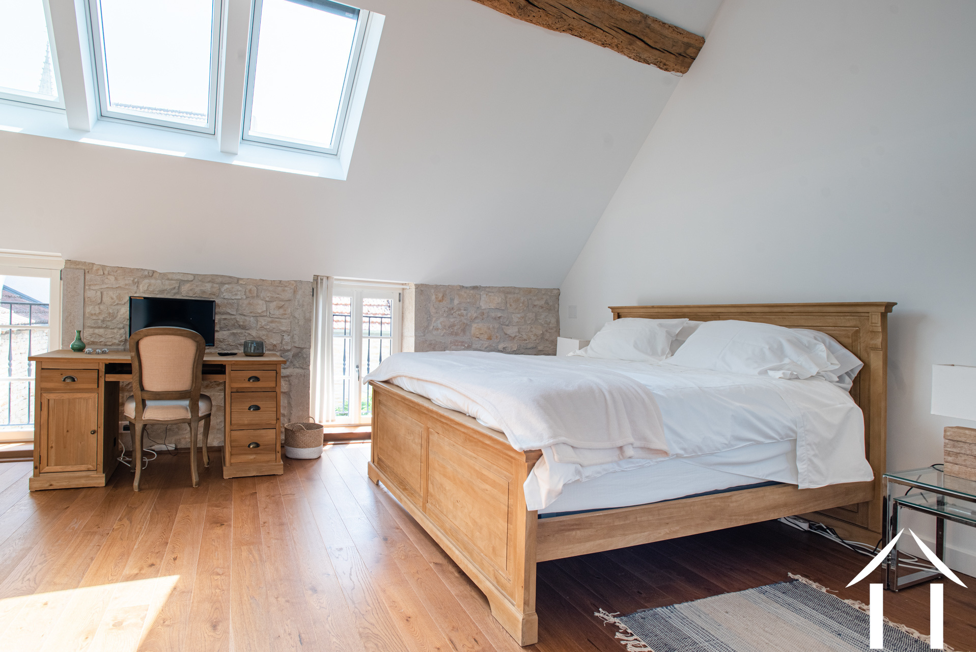 Master bedroom with wooden floors