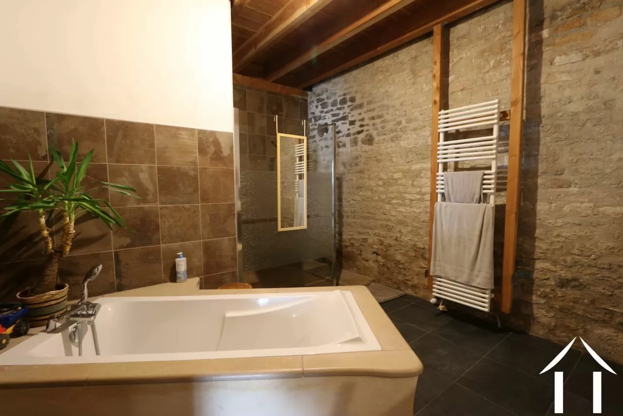 Bathroom with bath and shower