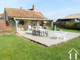 This shows the smaller, two roomed outbuilding with its terrace