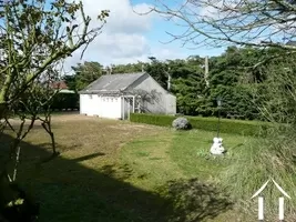 Shows the rear garden and the garage block. 