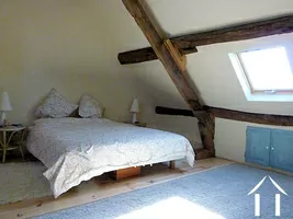 Bedroom with en suite upstairs with exposed beams