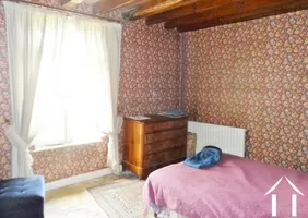 one of the bedrooms with beams and tommettes floors