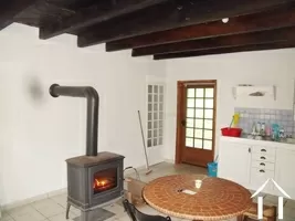 large kitchen with woodburner