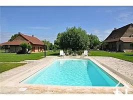 pool, main house on the right and the guest house on the left