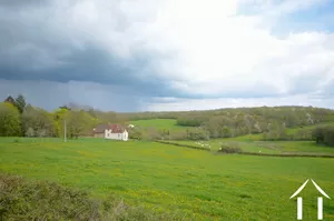 property surrounded by rolling hills