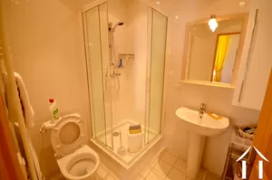 Shower room with toilet accessed via the hallway