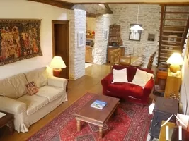 living room with wood burner and parquet floor