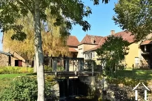 Famhouse and courtyard seen from the river