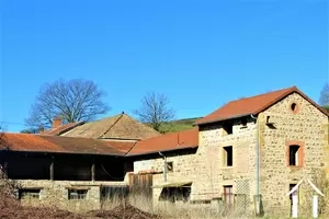 farmhouse with large adjoining outbuildings