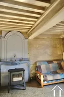 Salon-salle à manger avec cheminée gainée et poêle à bois