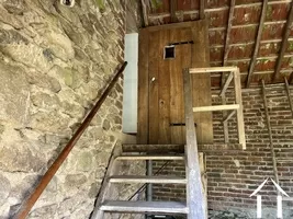 stairs up to bedroom in second house, with toilet