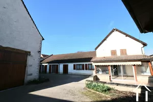 House and barn in enclosed courtyard