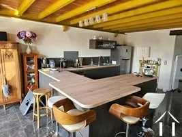 Spacious kitchen island featuring comfortable seating